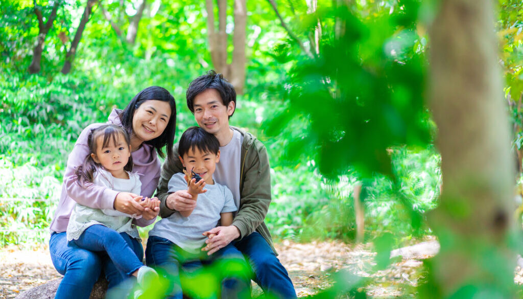 Family playing in the forest