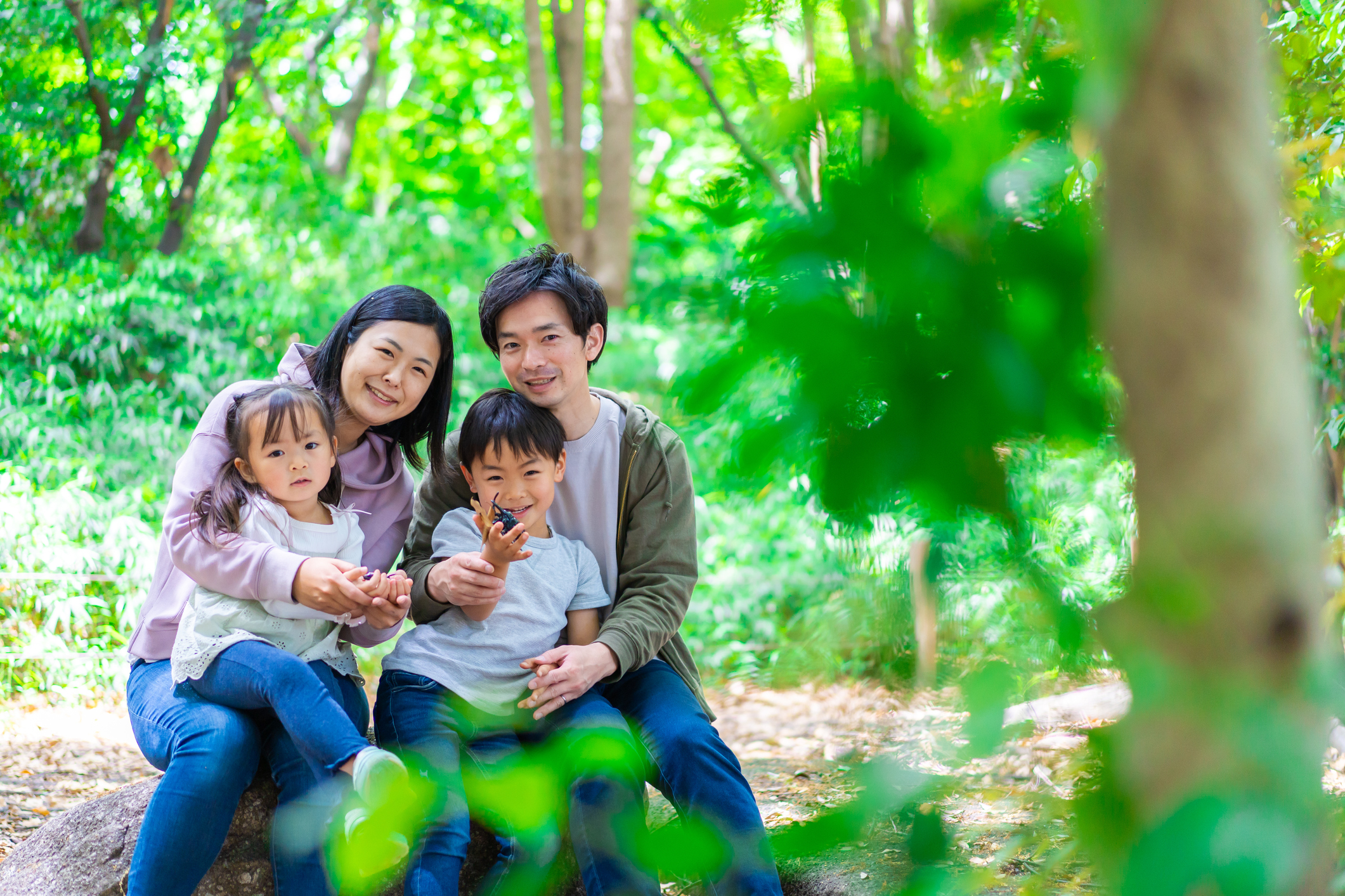 Family playing in the forest